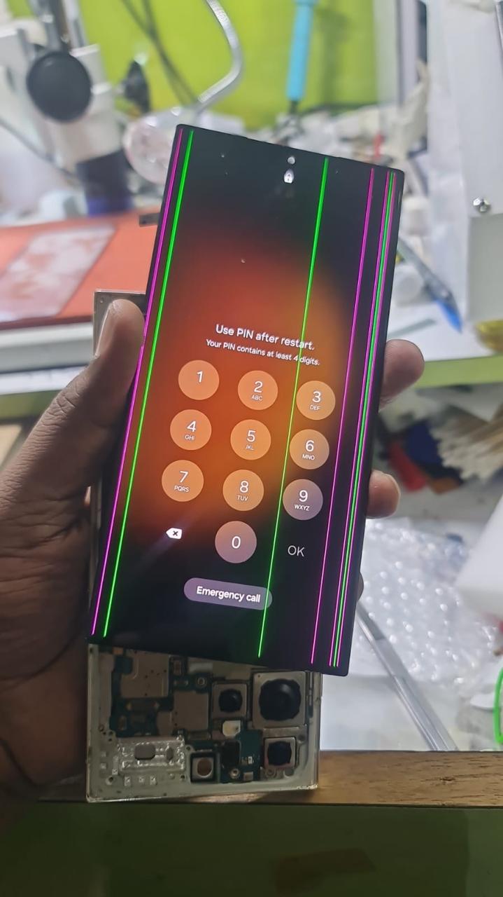 Phone screen showing thick green vertical line before repair