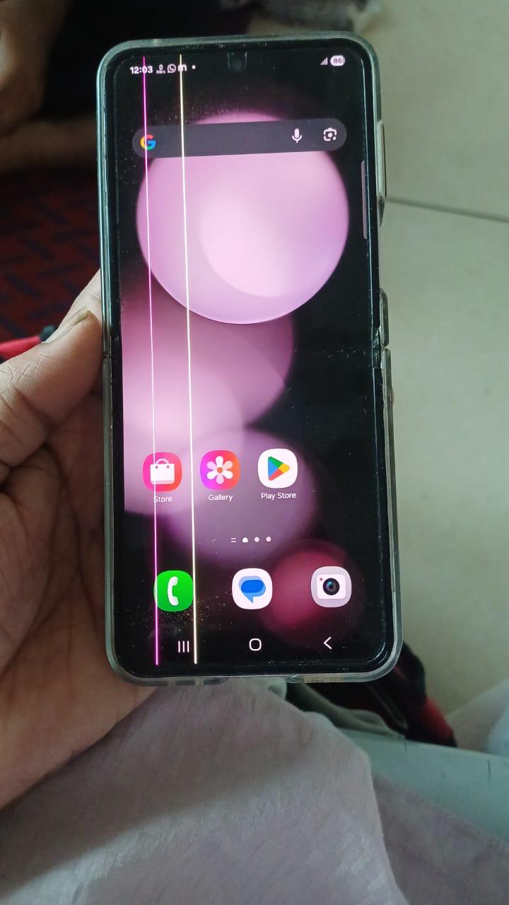 Multiple vertical lines on smartphone screen indicating display fault